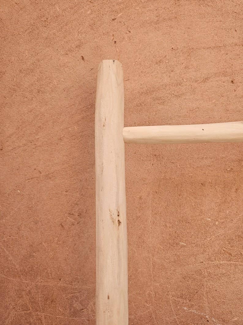 Decorative Wooden Ladder: A Chic Towel Storage Option