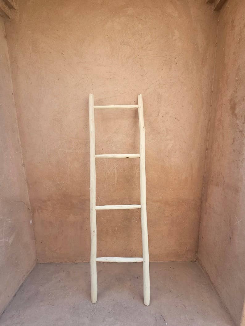 Decorative Wooden Ladder: A Chic Towel Storage Option