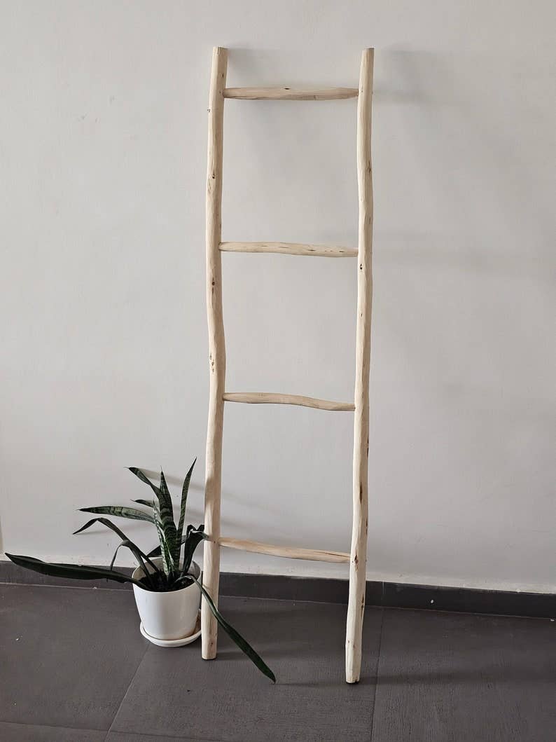 Decorative Wooden Ladder: A Chic Towel Storage Option