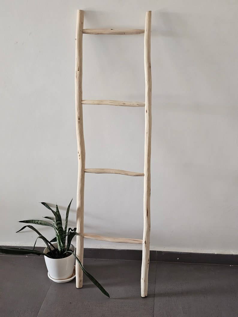 Decorative Wooden Ladder: A Chic Towel Storage Option